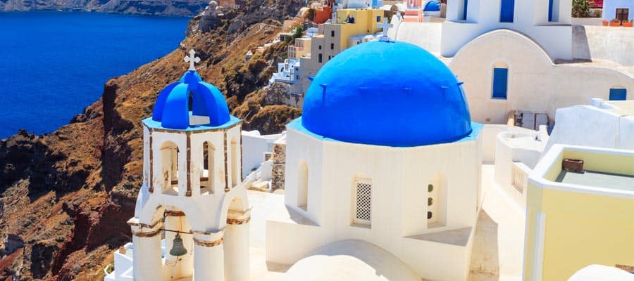 Famous blue domed churches on a Santorini cruise